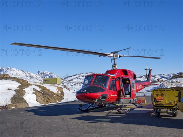 Bell 212 helicopter on the helipad of Tasiilaq