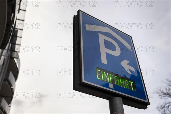 A sign indicates the entrance to a multi-storey car park. Berlin