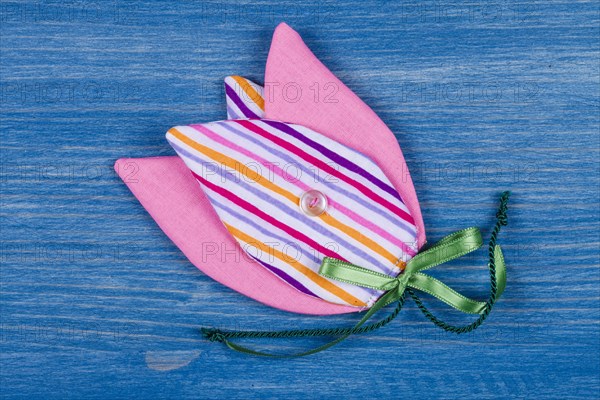 Fabric tulip on blue background