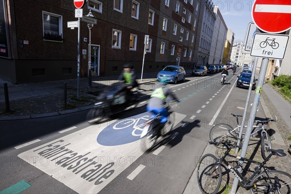 Symbolic photo on the subject of bicycle lanes in the city. Cyclists ride on the bicycle street in Linienstrasse in Berlin Mitte. Berlin