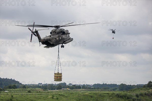 Two Bundeswehr helicopters with fire extinguishing tank 5000 litres