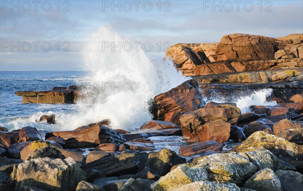 Water dashing against rocks on the rocky coast of Isle of Skye