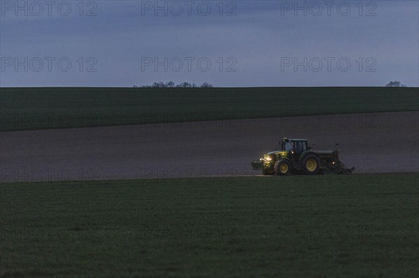 A tractor with a seed drill photographed Reichenbach Oberlausitz