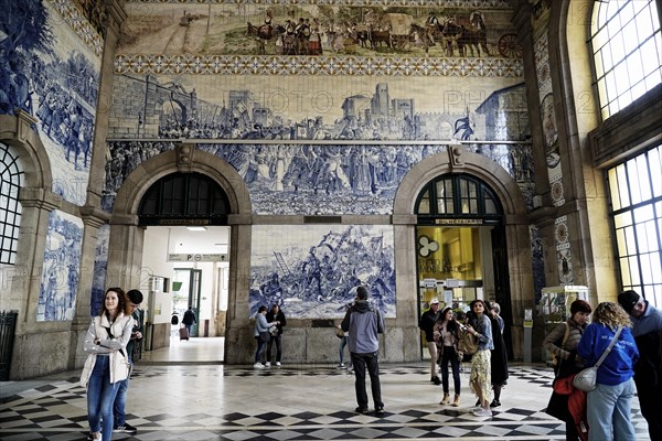 View of azulejos on walls of ornate interior of Arrivals Hall at Sao Bento Railway Station in Porto