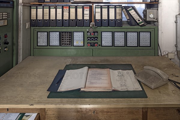 Work table with microphone in the control room of a former paper factory