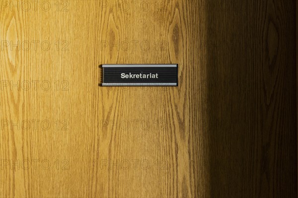 A sign saying secretary's office hangs on a door in the old primary school in Trinwillershagen