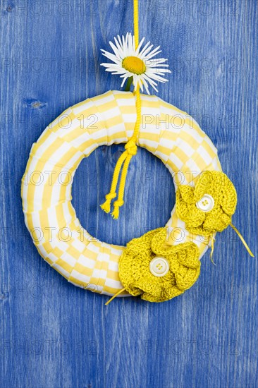 Decorative wreath on blue background