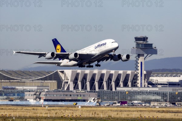 Airbus A380-800 of the airline Lufthansa taking off at Fraport Airport