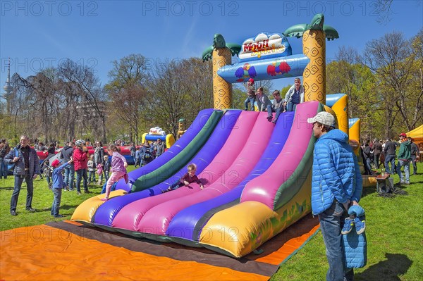 Inflatable plastic slide in springtime Luitpoldpark