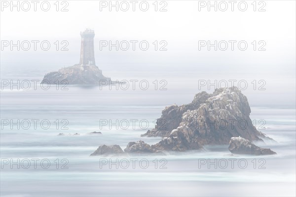 The lighthouse La Vieille in the strait Raz de Sein in thick fog