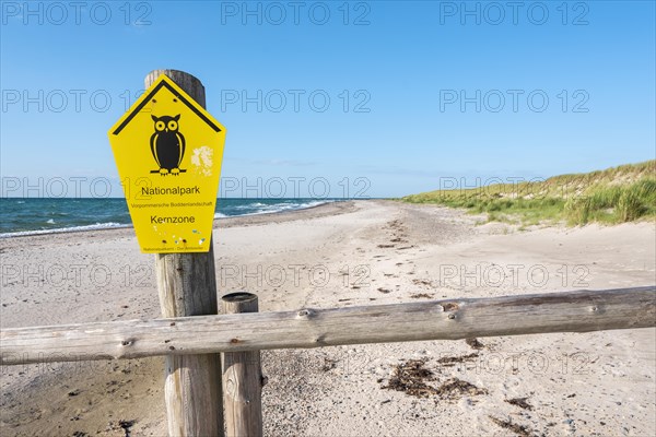 Fence on the beach of the Baltic Sea as the border of the closed-off core zone of the National Park Vorpommersche Boddenlandschaft