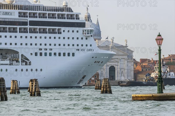 A cruise ship is heading for the Stazione Marittima cruise terminal. Meanwhile