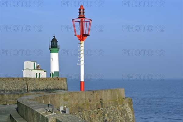 Lighthouse and marine beacon on jetty at Le Treport