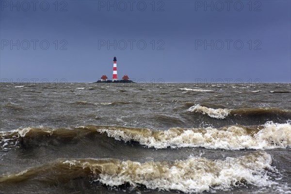 Lighthouse Westerheversand at Westerhever during high water spring tide