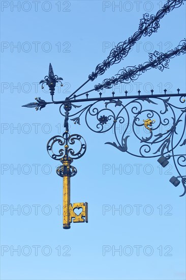 Signboard with decorations at Gasthof Schluessel