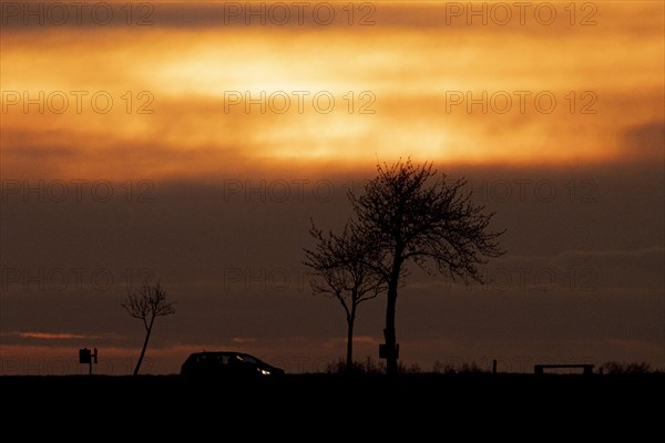 A car stands out in the dusk near Gebelzig