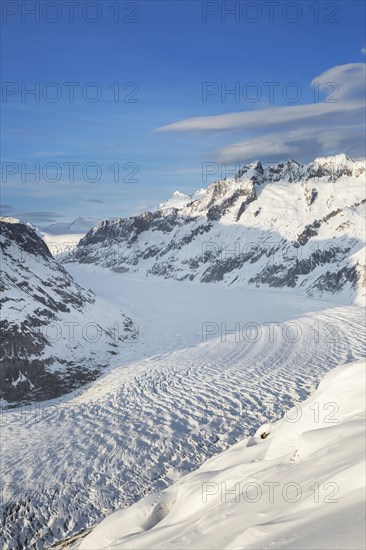 View over the mountains in winter surrounding the Swiss Aletsch Glacier