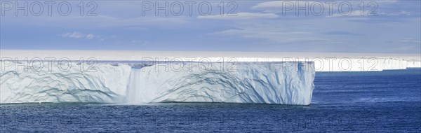 Waterfall at edge of the Brasvellbreen glacier from the ice cap Austfonna debouching into the Barents Sea