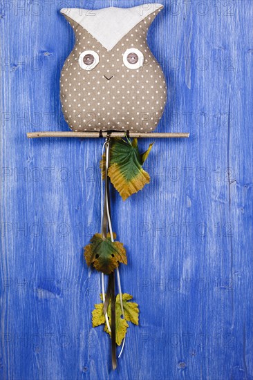 Fabric owl on blue background