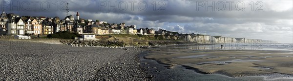 View over the chalk cliffs and the village Ault seen from the pebble beach