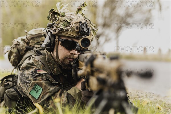 A Bundeswehr soldier with rifle at the ready