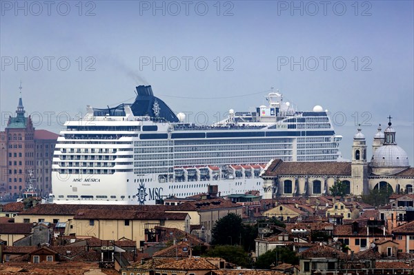 The cruise ship MSC Musica of the shipping company MSC Cruises sails to the cruise terminal Stazione Marittima. Meanwhile