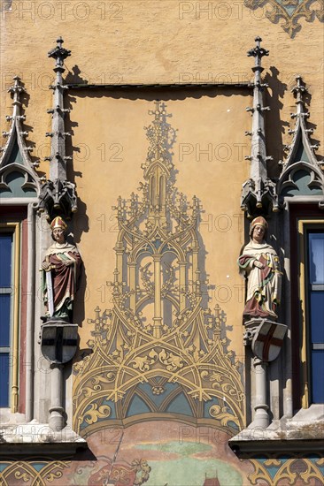 Ulm Town Hall with ornate windows with elector figures and facade with murals