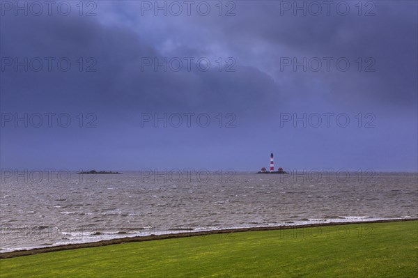 Lighthouse Westerheversand at Westerhever during high water spring tide