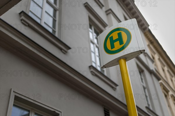 A sign points to a bus stop. Berlin