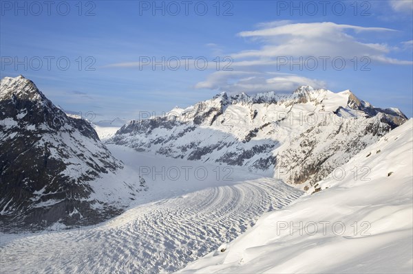 View over the mountains in winter surrounding the Swiss Aletsch Glacier