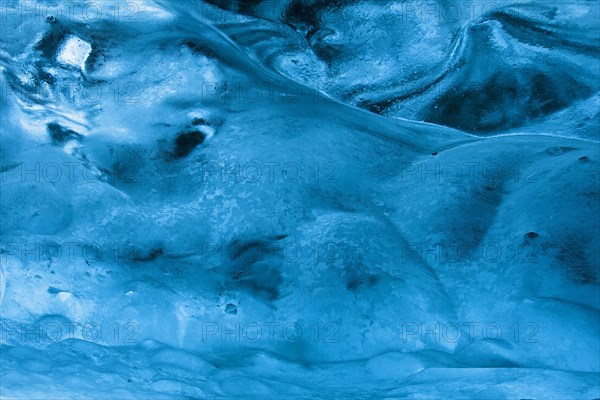 Blue ice mixed with volcanic ash in ice cavern inside Breidamerkurjokull