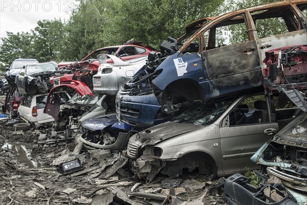 Crushed cars in scrap yard UK