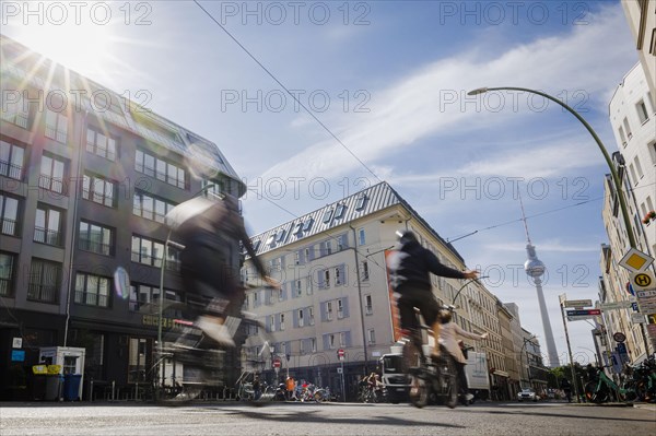 Symbolic photo on the subject of cycling in the city. Cyclists ride on the bicycle lane in Linienstrasse in Berlin Mitte. Berlin