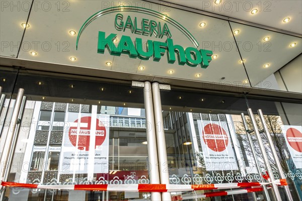 Closed entrance doors of a Galeria Kaufhof shop that is about to close