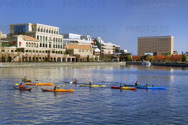 Group of kayaks on excursion in Minato Mirai 21 MM Yokohama city Kanagawa Japan