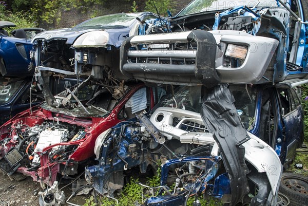 Crushed cars in scrap yard UK