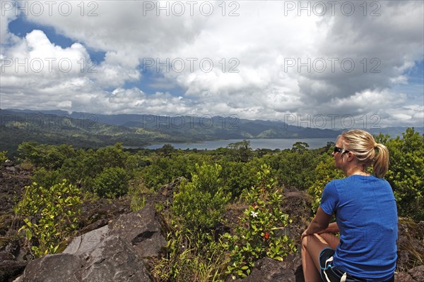 Woman looking at Lake Arenal