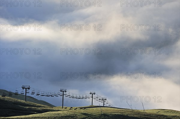 Chairlift in the mist at sunrise along the Col du Tourmalet in the Pyrenees