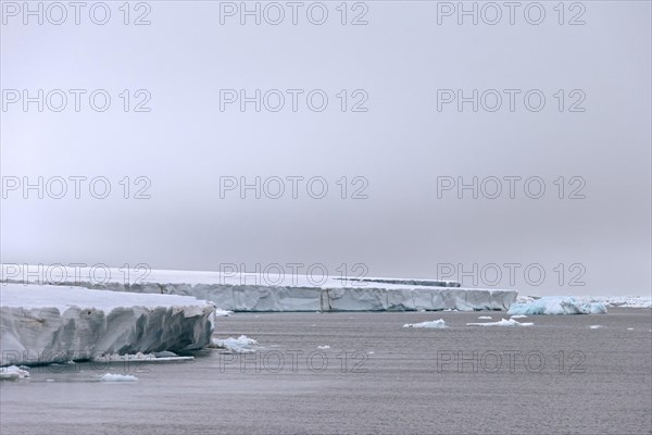 Ice wall of the Brasvellbreen glacier debouching into the Arctic Ocean