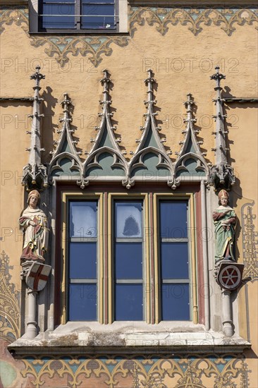 Ulm Town Hall with ornate windows with elector figures and facade with murals