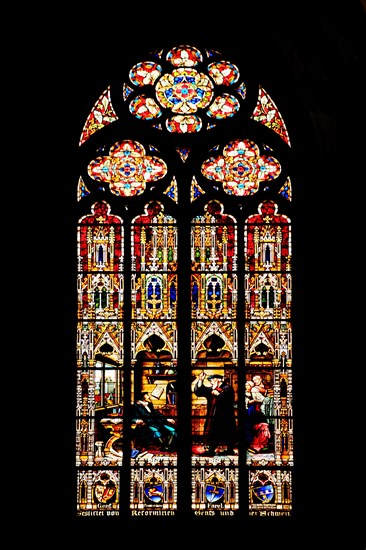 Stained glass window with John Calvin and Guillaume Farel in Geneva