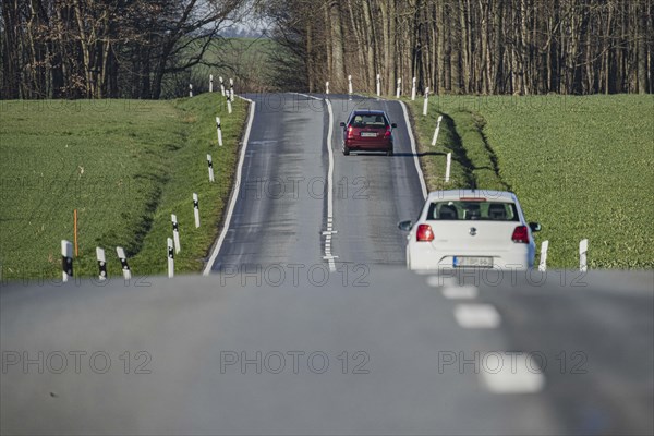 Two cars on a country road