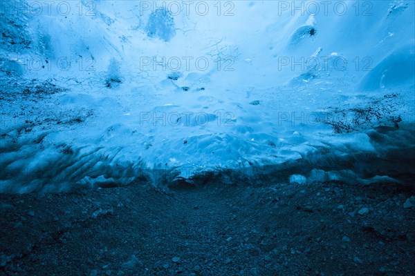 Blue ice mixed with volcanic ash in ice cavern inside Breidamerkurjokull