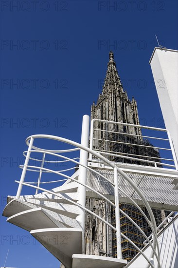 Architectural contrast of modern architectural details Town house and part of the west tower Ulm Cathedral