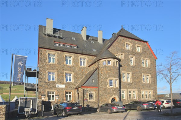 Historic customs office and present-day restaurant with flag and inscription