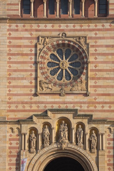 Rosette and figures at the entrance to the Romanesque UNESCO Cathedral