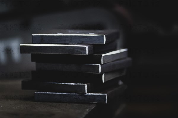 Metal plates lying on a workbench