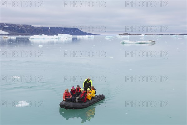 Zodiac boat with eco-tourists visiting Monacobreen