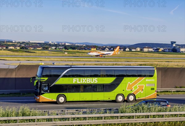 Flixbus on the road on the A8 motorway at the airport