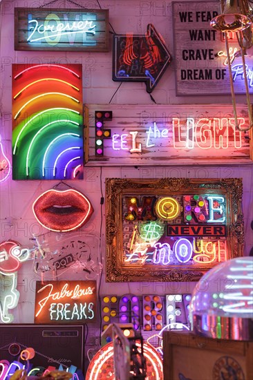 Room full of bright colourful neon signs